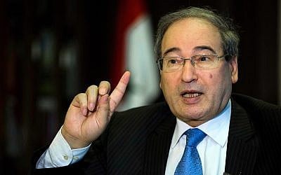 Syrian Deputy Foreign Minister Faisal Mekdad speaks during an interview with The Associated Press at his office in Damascus, Syria, April 13, 2016. (AP Photo/Hassan Ammar)