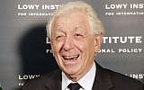 In this file photo from November 28, 2014, Football Federation Australia Chairman Frank Lowy smiles as he greets Myanmar's Aung San Suu Kyi at the Lowy Institute in Sydney. (AP Photo/Rick Rycroft, File)