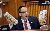 Sen. Simcha Felder, D-Brooklyn asks New York City Mayor Bill de Blasio if he knows the cost of a loaf of bread and a dozen eggs during a joint legislative budget hearing on local government on Monday, January 30, 2017, in Albany, New York. (AP Photo/Hans Pennink)