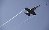 Illustrative image of a US F-18 fighter jet flies over the USS George H.W. Bush as the vessel travels toward the Strait of Hormuz on March 20, 2017. (AP Photo/Jon Gambrell)