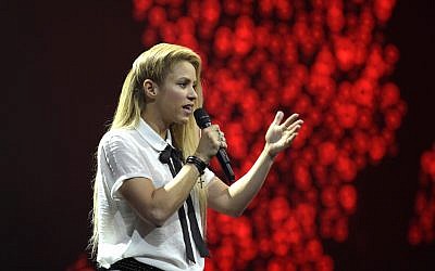 Singer Shakira speaks to the crowd during the Global Citizen Festival concert on the eve of the G-20 summit in Hamburg, northern Germany, Thursday, July 6, 2017. (AP Photo/Jens Meyer)