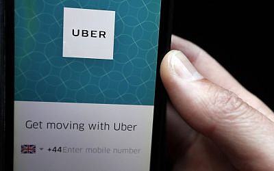 In this September 22, 2017 photo, an Uber App is displayed on a phone in London. (AP Photo/Kirsty Wigglesworth)