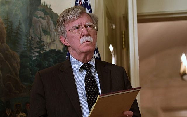 National security adviser John Bolton listens President Donald Trump speaks in the Diplomatic Reception Room of the White House on Friday, April 13, 2018, in Washington, about the United States' military response to Syria's chemical weapon attack on April 7. (AP Photo/Susan Walsh)