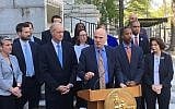 District of Columbia City Council President Phil Mendelson speaks during an impromptu news conference outside City Hall, Tuesday, May 1, 2018 in Washington, as other council members listen. (AP Photo/Ashraf Khalil)