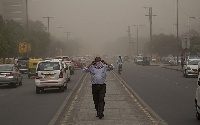 In this May 2, 2018, file photo, a man wraps a scarf around his nose as a dust storm envelops the city in New Delhi, India. (AP Photo/Manish Swarup, File) In this May 2, 2018, file photo, a man wraps a scarf around his nose as a dust storm envelops the city in New Delhi, India. (AP Photo/Manish Swarup, File)