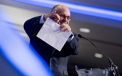 Rudy Giuliani, an attorney for President Donald Trump, pretends to tear a piece of paper as he speaks about the Iran nuclear agreement while speaking at the Iran Freedom Convention for Human Rights and democracy at the Grand Hyatt, Saturday, May 5, 2018, in Washington. (AP Photo/Andrew Harnik)