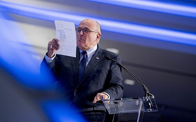 Rudy Giuliani, an attorney for President Donald Trump, pretends to spit on a piece of paper as he speaks about the Iran nuclear agreement at the Iran Freedom Convention for Human Rights and democracy, Saturday, May 5, 2018, in Washington. (AP Photo/Andrew Harnik) Rudy Giuliani, an attorney for President Donald Trump, pretends to spit on a piece of paper as he speaks about the Iran nuclear agreement at the Iran Freedom Convention for Human Rights and democracy, Saturday, May 5, 2018, in Washington. (AP Photo/Andrew Harnik)