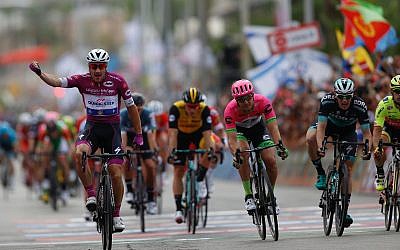 Italian cyclist Elia Viviani reacts as he crosses the finish line during the third stage of 2018 Giro d'Italia, Tour of Italy cycling race, in the Red Sea city of Eilat, on May 6, 2018. (AP Photo/Ariel Schalit)