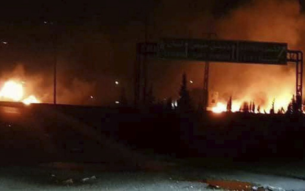 Illustrative: Flames rising after an attack in an area known to have numerous Syrian army military bases, in Kisweh, south of Damascus, released by Syria's official news agency on May 9, 2018. (SANA, via AP) Illustrative: Flames rising after an attack in an area known to have numerous Syrian army military bases, in Kisweh, south of Damascus, released by Syria's official news agency on May 9, 2018. (SANA, via AP)