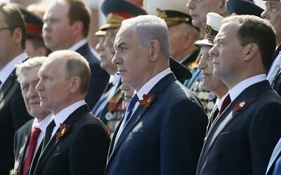 Russian President Vladimir Putin, left, Prime Minister Benjamin Netanyahu, center, and Russian Prime Minister Dmitry Medvedev, right, attend a military parade celebrating 73 years since the victory in WWII, in Red Square, Moscow, Russia, May 9, 2018. (Maxim Shipenkov/Pool Photo via AP)