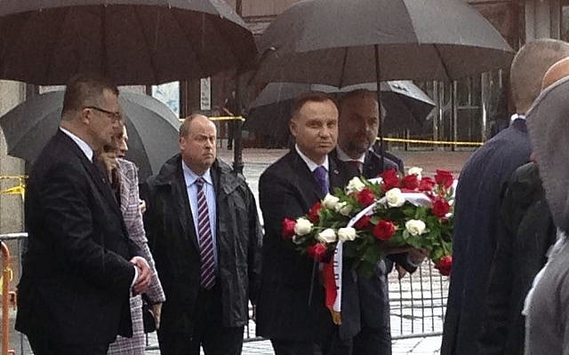 The president of Poland, Andrzej Duda, center, carries a bouquet of roses toward the waterfront statue commemorating the 1940 Soviet massacre of Poles, Wednesday, May 16, 2018. (AP Photo/David Porter) The president of Poland, Andrzej Duda, center, carries a bouquet of roses toward the waterfront statue commemorating the 1940 Soviet massacre of Poles, Wednesday, May 16, 2018. (AP Photo/David Porter)