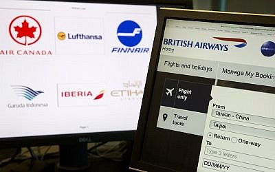 In this May 21, 2018, photo, a computer screens display the booking website of British Airways showing "Taiwan-China" in Beijing, China. (AP Photo/Ng Han Guan) In this May 21, 2018, photo, a computer screens display the booking website of British Airways showing "Taiwan-China" in Beijing, China. (AP Photo/Ng Han Guan)