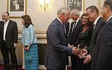 Britain's Prince Charles shakes hands with Israel's Ambassador to the UK Mark Regev and peaks to dignitaries as he attends 'Platinum – Israel at 70,' the Jewish community's celebration of the 70th Anniversary of the founding of the State of Israel, at the Royal Albert Hall in London, Thursday, May 24, 2018. (AP Photo/Frank Augstein, pool)