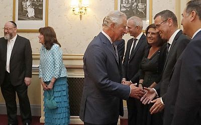 Britain's Prince Charles shakes hands with Israel's Ambassador to the UK Mark Regev and peaks to dignitaries as he attends 'Platinum – Israel at 70,' the Jewish community's celebration of the 70th Anniversary of the founding of the State of Israel, at the Royal Albert Hall in London, Thursday, May 24, 2018. (AP Photo/Frank Augstein, pool) Britain's Prince Charles shakes hands with Israel's Ambassador to the UK Mark Regev and peaks to dignitaries as he attends 'Platinum – Israel at 70,' the Jewish community's celebration of the 70th Anniversary of the founding of the State of Israel, at the Royal Albert Hall in London, Thursday, May 24, 2018. (AP Photo/Frank Augstein, pool)