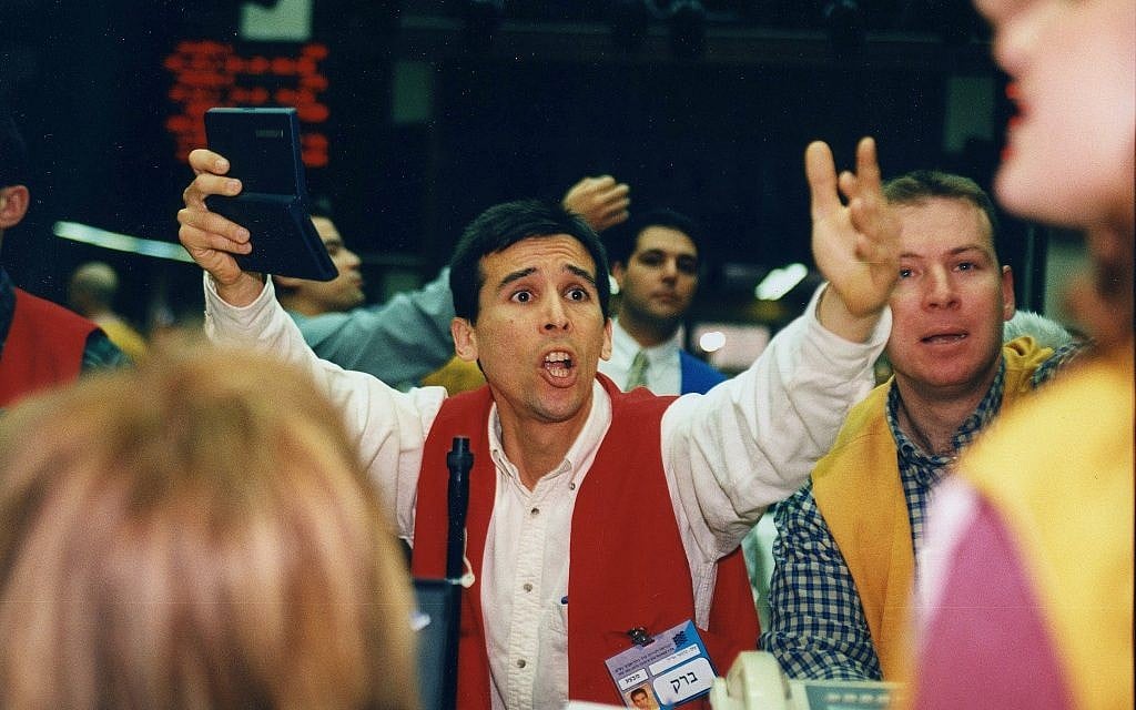 A broker at the Tel Aviv Stock exchange. (Moshe Shai/Flash90) A broker at the Tel Aviv Stock exchange. (Moshe Shai/Flash90)