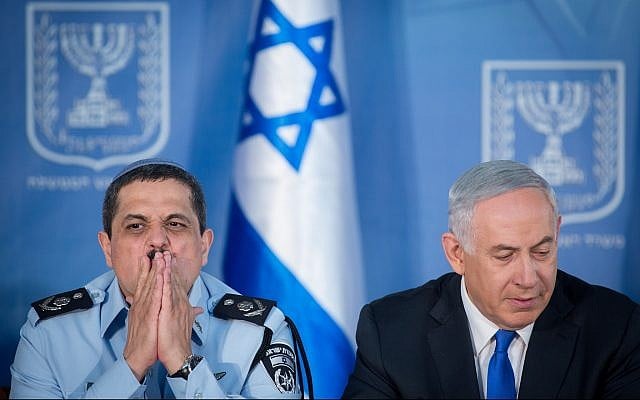 Then Police Commissioner Roni Alsheich, left, and Prime Minister Benjamin Netanyahu at a ceremony welcoming Alsheich to the job, at the Prime Minister's Office in Jerusalem on December 3, 2015. (Miriam Alster/Flash90) Then Police Commissioner Roni Alsheich, left, and Prime Minister Benjamin Netanyahu at a ceremony welcoming Alsheich to the job, at the Prime Minister's Office in Jerusalem on December 3, 2015. (Miriam Alster/Flash90)