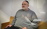 Yehoshua Elitzur who was convicted of killing Palestinian taxi driver Sael a-Shatiya in 2004, is seen at the Tel Aviv District Court after he was extradited from Brazil, January 18, 2018. (Flash90)