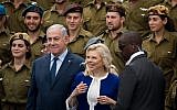 Prime Minister Benjamin Netanyahu and his wife Sara during a ceremony of awards for outstanding soldiers as part of Israel's 70th Independence Day celebrations, at the President's residence in Jerusalem, April 19, 2018. (Yonatan Sindel/Flash90)