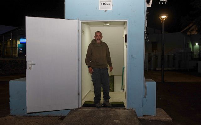 A man seen at the entrance to a bomb shelter that was open tonight in the Golan Heights, in northern Israel, May 8, 2018, (Basel Awidat/Flash90) A man seen at the entrance to a bomb shelter that was open tonight in the Golan Heights, in northern Israel, May 8, 2018, (Basel Awidat/Flash90)