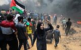 Palestinian protesters during clashes with Israeli forces near the Gaza-Israel border in Rafah, Gaza Strip on May 14, 2018. (Abed Rahim Khatib/Flash90)