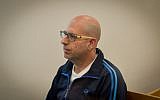 Former teacher Shaul Shamai arrives to the courtroom at the Tel Aviv District Court on May 21, 2018. (Flash90)