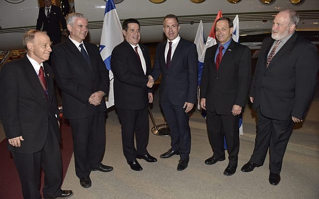 Paraguay' President Horacio Cartes (3rd-L) is greeted at Ben Gurion International Airport by Public Security Minister Gilad Erdan (3rd-R) after landing in Israel to attend the opening of the Paraguayan embassy in Jerusalem, on May 20, 2018. (Foreign Ministry) Paraguay' President Horacio Cartes (3rd-L) is greeted at Ben Gurion International Airport by Public Security Minister Gilad Erdan (3rd-R) after landing in Israel to attend the opening of the Paraguayan embassy in Jerusalem, on May 20, 2018. (Foreign Ministry)