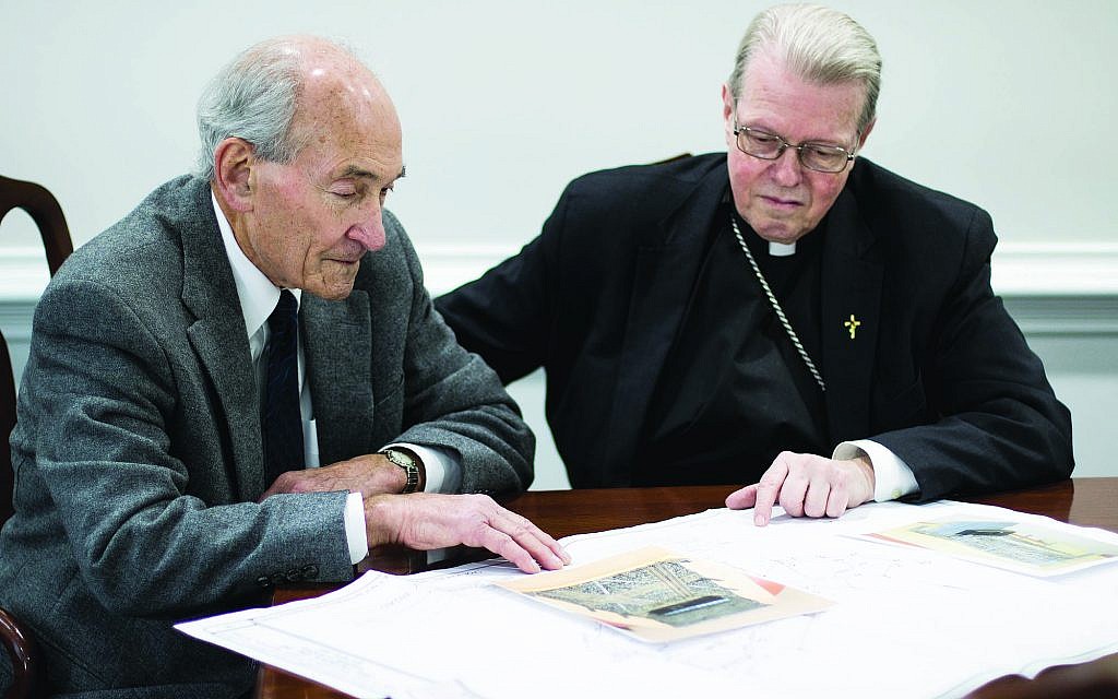 Dr. Michael Lozman, left, with Bishop Edward Scharfenberger go over plans for the memorial. (Courtesy) Dr. Michael Lozman, left, with Bishop Edward Scharfenberger go over plans for the memorial. (Courtesy)