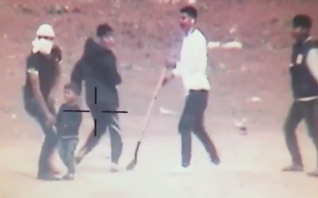 A small Gazan child next to youths during violent protests at the Gaza border, in footage released by the IDF on May 5, 2018 (screenshot) A small Gazan child next to youths during violent protests at the Gaza border, in footage released by the IDF on May 5, 2018 (screenshot)