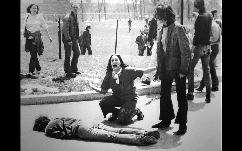 John Filo’s Pulitzer Prize–winning photograph of Mary Ann Vecchio, a 14-year-old runaway, kneeling over the body of Jeffrey Miller minutes after he was fatally shot by the Ohio National Guard at Kent State University on May 4, 1970. (Via JTA) John Filo’s Pulitzer Prize–winning photograph of Mary Ann Vecchio, a 14-year-old runaway, kneeling over the body of Jeffrey Miller minutes after he was fatally shot by the Ohio National Guard at Kent State University on May 4, 1970. (Via JTA)