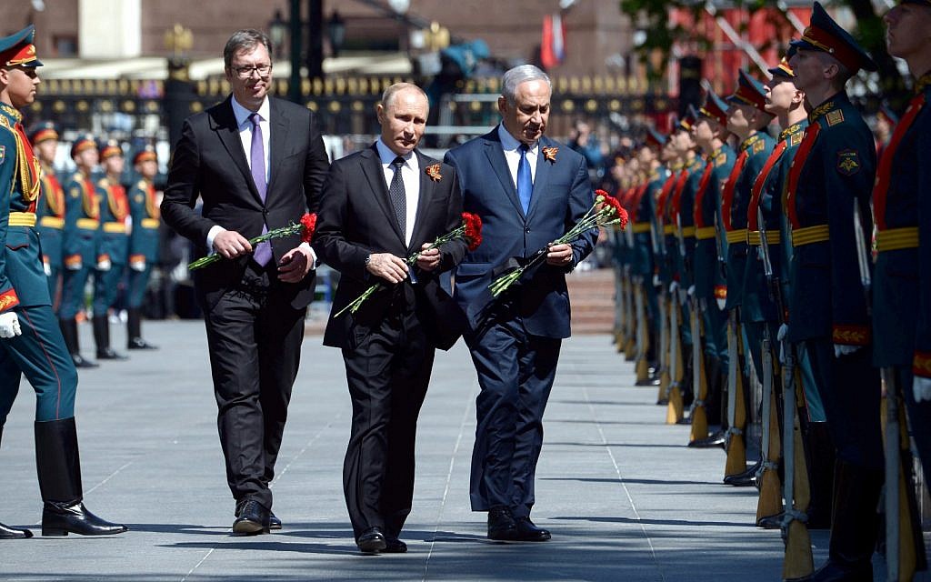 (R to L) Prime Minister Benjamin Netanyahu, Russian President Vladimir Putin and Serb President Aleksandar Vucic attend a wreath-laying ceremony for the unknown soldier at the memorial for Red Army soldiers in Moscow, Russia, on April 9, 2018. (GPO Amos Ben-Gershom)