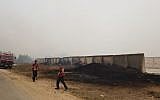 Fire fighters work to control fire near the southern moshav of GIlat. (Fire and Rescue Services)