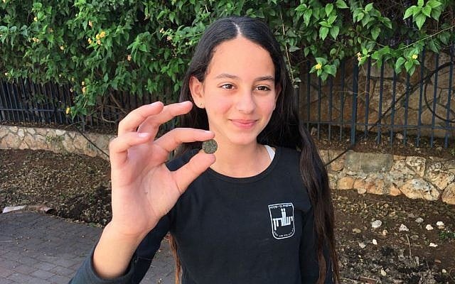 One of the two ancient bronze coins discovered as Temple Mount soil was sifted in the city of Petach Tikva by Yeshurun High school students (Inbal Dasberg/Temple Mount Sifting Project)