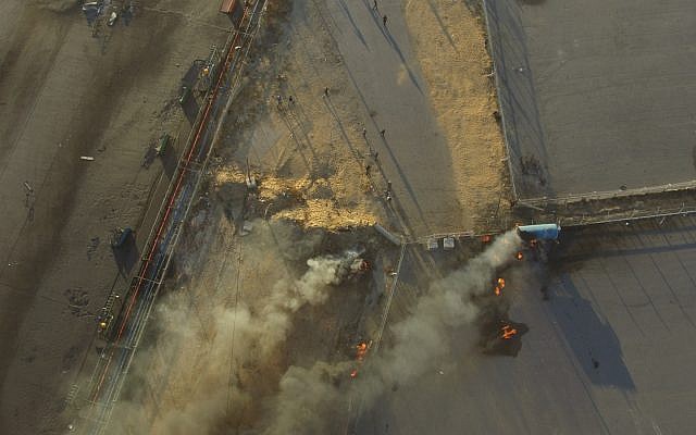 An aerial view of Palestinian rioters setting fire to the Gaza Strip's Kerem Shalom Crossing on May 14, 2018. (Israel Defense Forces) An aerial view of Palestinian rioters setting fire to the Gaza Strip's Kerem Shalom Crossing on May 14, 2018. (Israel Defense Forces)