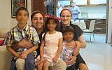 Yaron Atias and his wife Mazal Dadon Atias pictured with their children in September 2015. (Facebook)