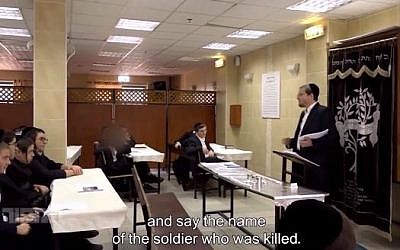 Menachem Bombach and his students learning about Israel's Memorial Day (via Facebook)