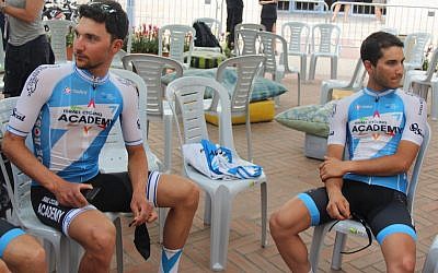 Guy Sagiv, left, and Guy Niv relaxing before the opening ceremonies of the Giro d’Italia in Jerusalem, May 3, 2018. (Ben Sales/JTA)