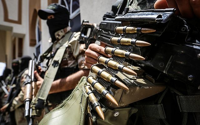 Islamic Jihad members guard outside the funeral of a group militiama, Hussein al-Amour, in Khan Younis in the southern Gaza Strip, on May 27, 2018. Al-Amour was killed during an Israeli strike . (Abed Rahim Khatib/Flash90) Islamic Jihad members guard outside the funeral of a group militiama, Hussein al-Amour, in Khan Younis in the southern Gaza Strip, on May 27, 2018. Al-Amour was killed during an Israeli strike . (Abed Rahim Khatib/Flash90)