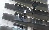 Mamoudou Gassama scales a Paris building to save a child, May 2018 (YouTube screenshot)
