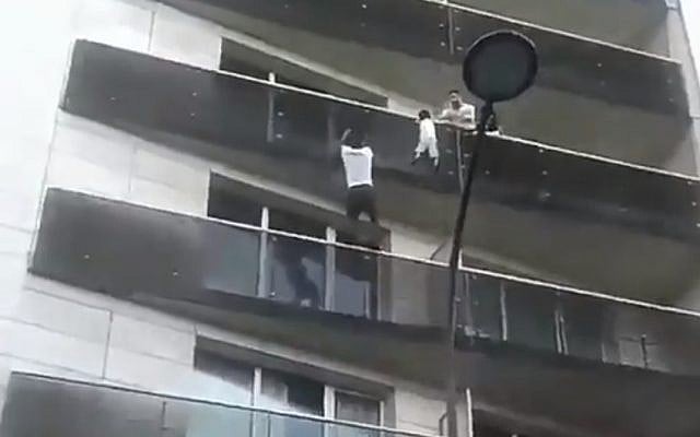 Mamoudou Gassama scales a Paris building to save a child, May 2018 (YouTube screenshot) Mamoudou Gassama scales a Paris building to save a child, May 2018 (YouTube screenshot)
