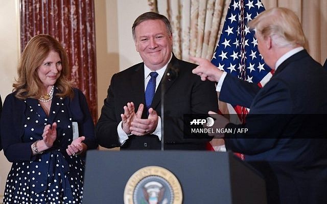 US President Donald Trump (R) points to US Secretary of State Mike Pompeo while Pompeo's wife Susan applauds during his ceremonial swearing-in at the State Department on May 2, 2018. (Mandel Ngan/AFP) US President Donald Trump (R) points to US Secretary of State Mike Pompeo while Pompeo's wife Susan applauds during his ceremonial swearing-in at the State Department on May 2, 2018. (Mandel Ngan/AFP)