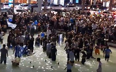 Israeli revelers at Rabin Square in Tel Aviv on May 13, 2018, celebrating Netta Barzilai's Eurovision Song Contest victory. ( Screen capture: YouTube)