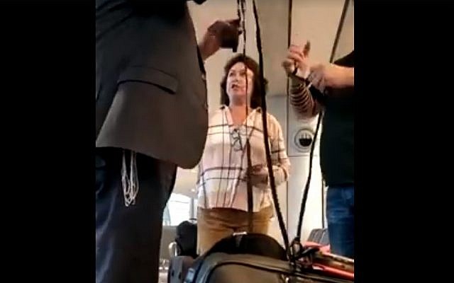Pnina Peri berates man for putting on tefillin at Ben Gurion airport on May 28, 2018. (Screen capture: Facebook/Gad Kaufman) Pnina Peri berates man for putting on tefillin at Ben Gurion airport on May 28, 2018. (Screen capture: Facebook/Gad Kaufman)