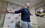 Anti-Kremlin journalist Arkady Babchenko speaks as he stands in front of a portrait of him that his colleagues displayed in his memory in the offices of his workplace, the ATR TV channel, on May 31, 2018 in Kiev. (AFP/Genya SAVILOV)