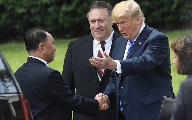 US President Donald Trump shakes hands with North Korean Kim Yong Chol (L) outside the White House on June 1, 2018 in Washington,DC after a meeting, as US Secretary of State Mike Pompeo(C) looks on. (AFP PHOTO / Saul LOEB) US President Donald Trump shakes hands with North Korean Kim Yong Chol (L) outside the White House on June 1, 2018 in Washington,DC after a meeting, as US Secretary of State Mike Pompeo(C) looks on. (AFP PHOTO / Saul LOEB)