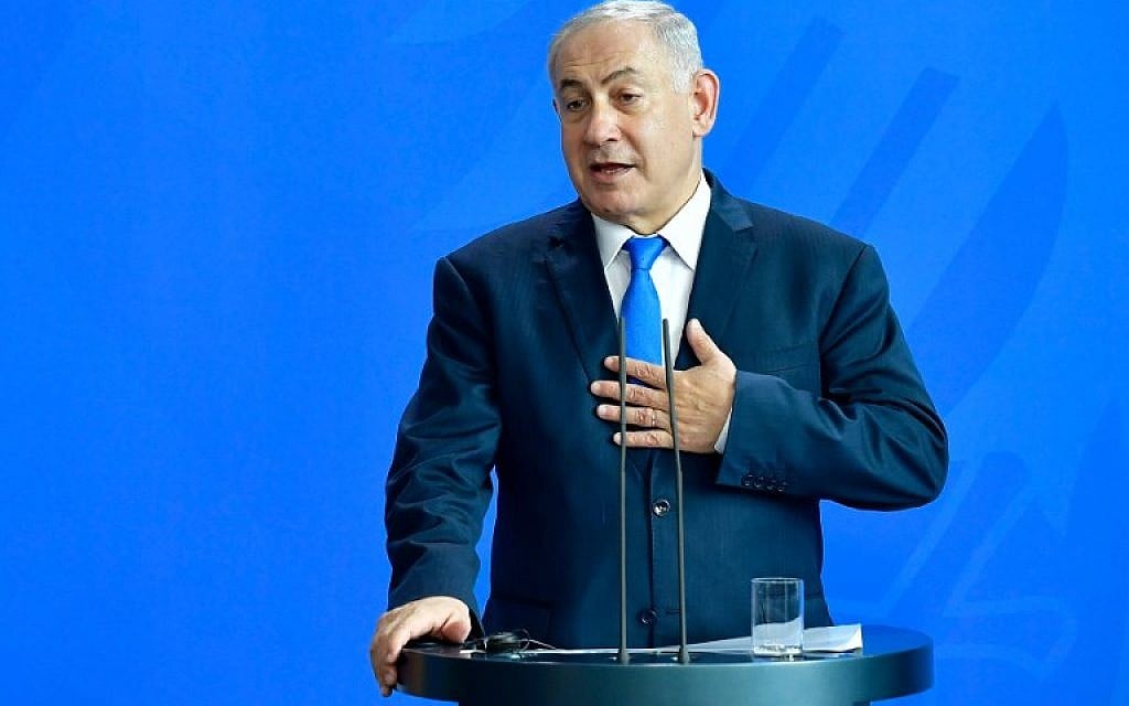 Prime Minister Benjamin Netanyahu addresses a press conference after a meeting with the German chancellor at the Chancellery in Berlin on June 4, 2018.  (AFP PHOTO / Tobias SCHWARZ)