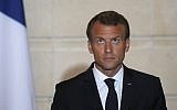 French President Emmanuel Macron listens as Israeli Prime Minister speaks during a joint press conference after their meeting at the Elysee Palace in Paris, on June 5, 2018. (PHILIPPE WOJAZER/AFP)