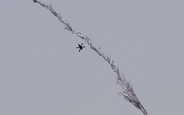 This picture taken from Kibbutz Nahal Oz across the border from the Gaza Strip shows an Israeli drone intercepting a flaming kite on June 8, 2018. (AFP Photo/Jack Guez)
