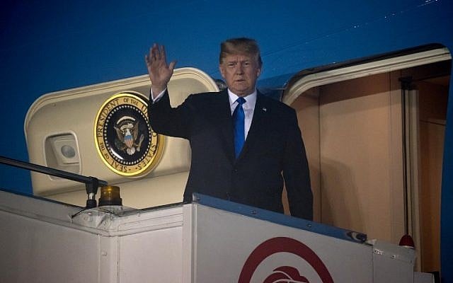 US President Donald Trump waves after Air Force One arrived at Paya Lebar Air Base in Singapore on June 10, 2018. (SAUL LOEB/AFP) US President Donald Trump waves after Air Force One arrived at Paya Lebar Air Base in Singapore on June 10, 2018. (SAUL LOEB/AFP)
