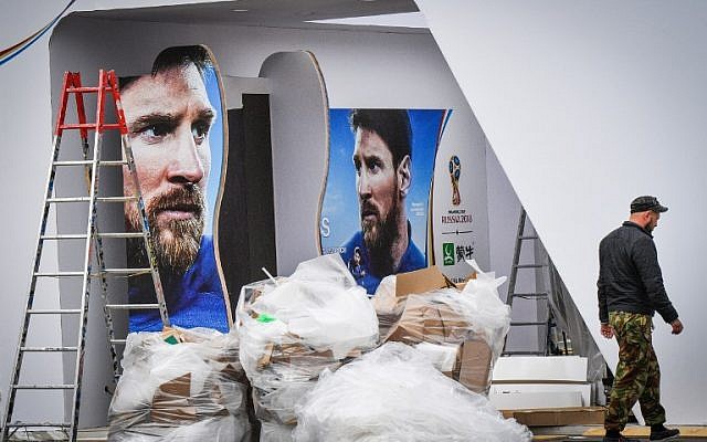 A man passes in front of commercial banners displaying Argentina's player Lionel Messi at Luzhniki stadium in Moscow on June 10, 2018, ahead of the Russia 2018 World Cup. (AFP PHOTO / Mladen ANTONOV) A man passes in front of commercial banners displaying Argentina's player Lionel Messi at Luzhniki stadium in Moscow on June 10, 2018, ahead of the Russia 2018 World Cup. (AFP PHOTO / Mladen ANTONOV)