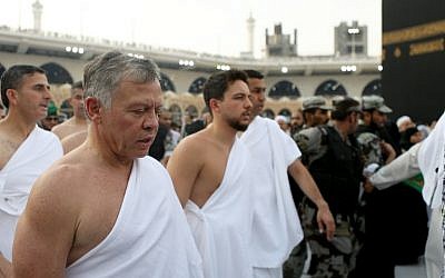 In this handout picture released on June 10, 2018, by the Jordanian Royal Palace, shows King Abdullah II, left, and his son Crown Prince Hussein bin Abdullah performing the off season pilgrimage of Umra in the holy city of Mecca. (AFP/Jordanian Royal Palace / Yousef ALLAN)